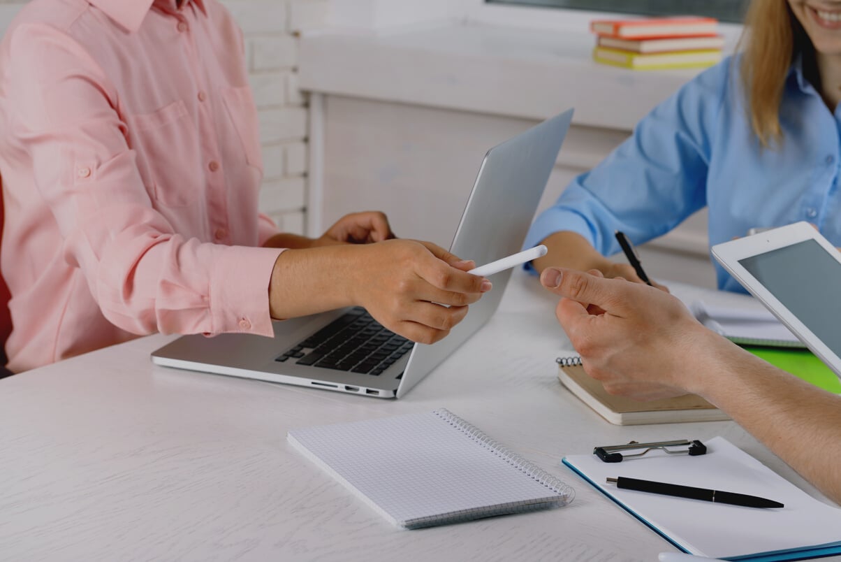 Close-up of Professionals Working on Office Table